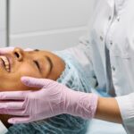 A client receiving a relaxing facial treatment at a modern spa clinic.