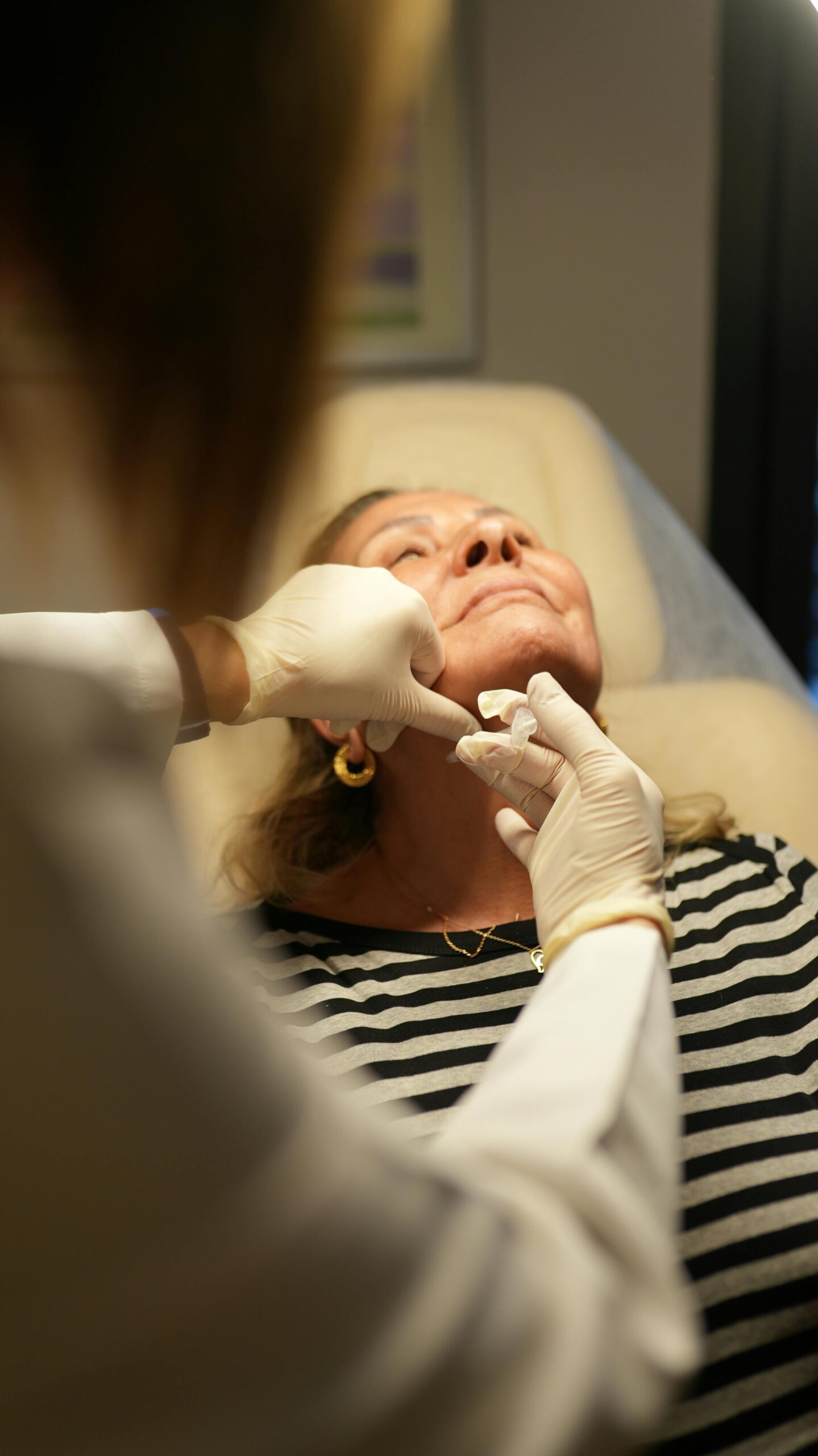 Aesthetic specialist performing chin dimpling treatment at Temecula medical spa